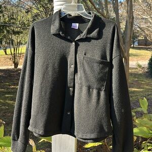 Black cropped sweater that lookss likee a button-up shirt. Size 15-17